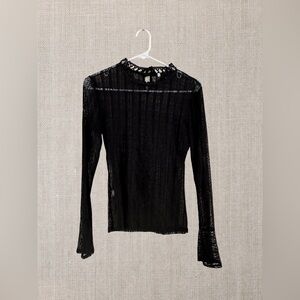 Sheer long sleeve top with arm flare